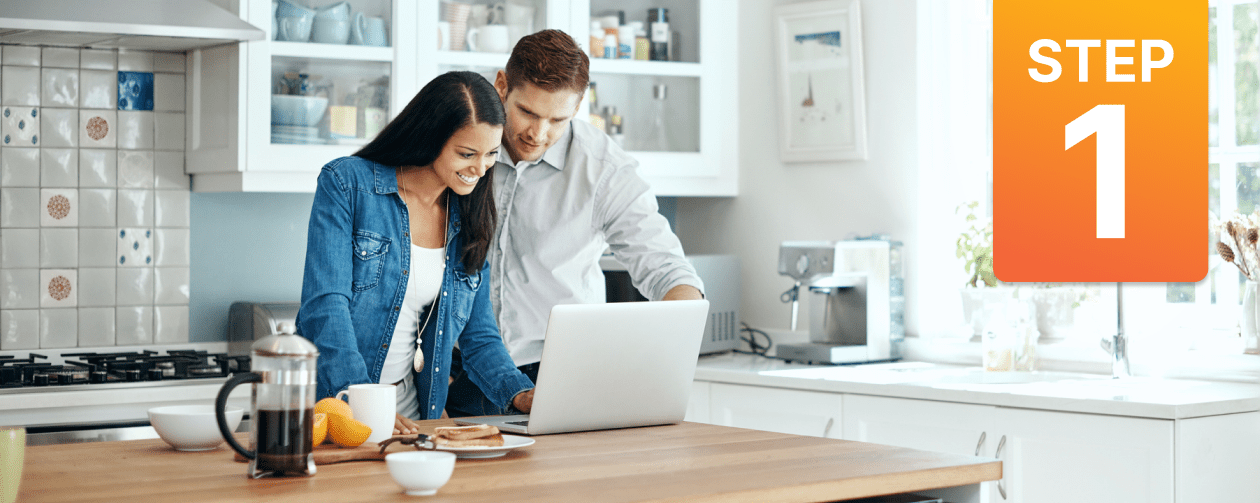 Couple happily reviewing a quote from their solar company