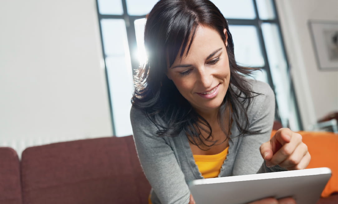 A woman looking at an ipad