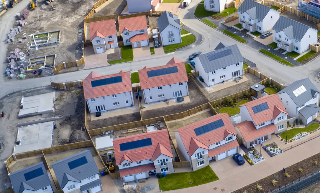 Arial view of neighborhood with solar panels on roof