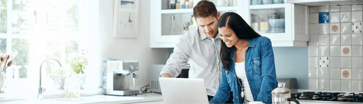 Couple happily reviewing a quote from their solar company.